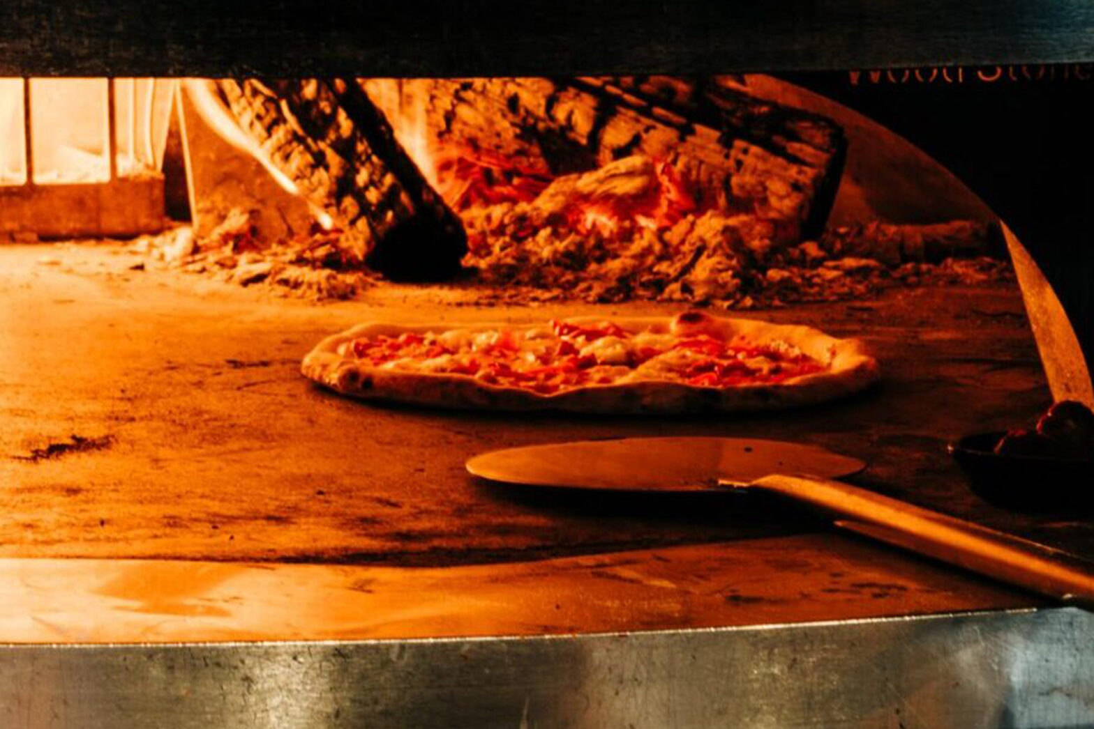 Savor the Aroma of Freshly Baked Pizza: A Culinary Delight Close to Food Hall Markets.